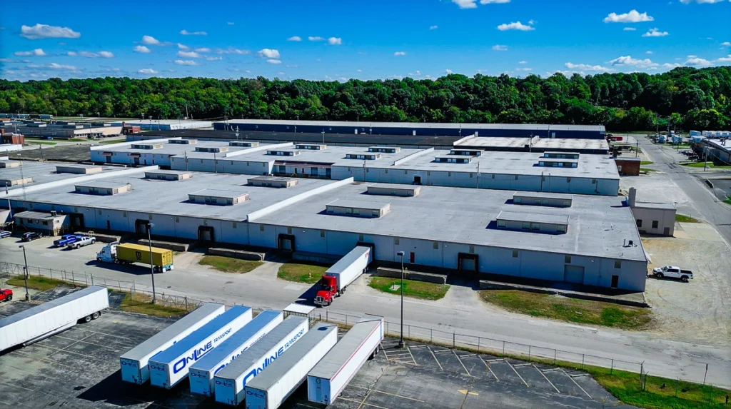 A Distributors Terminal driver unloading pallets, demonstrating asset-based trucking services in Indianapolis.